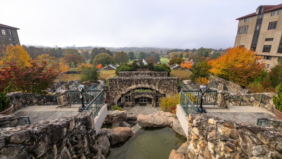 Exterior patio at Omni Grove Park Inn with fall foliage and mountains in background