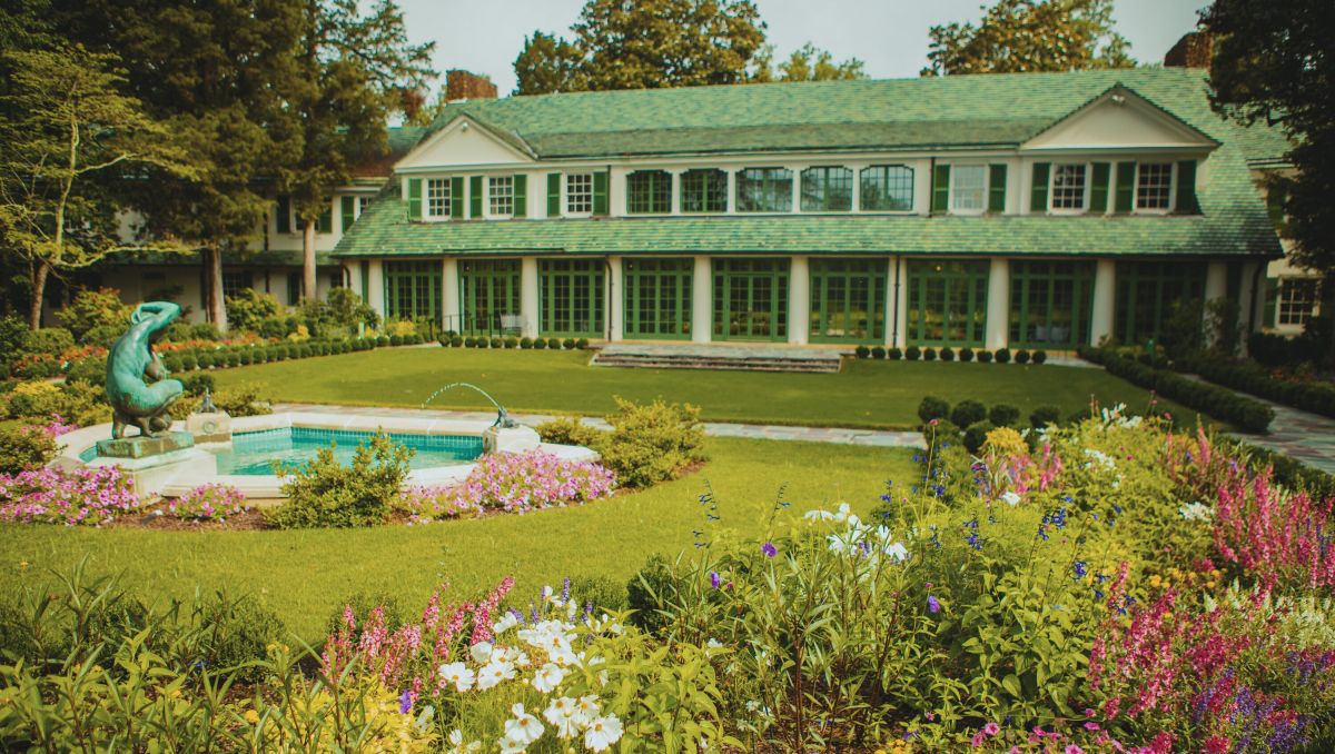 Reynolda House exterior in Winston-Salem with gardens and fountain in foreground